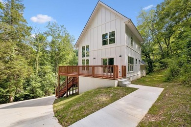 Nestled among mature trees in a desirable Center Hill Lake gated - photo 1