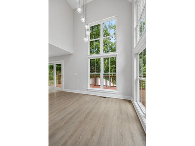 Nestled among mature trees in a desirable Center Hill Lake gated - photo 9