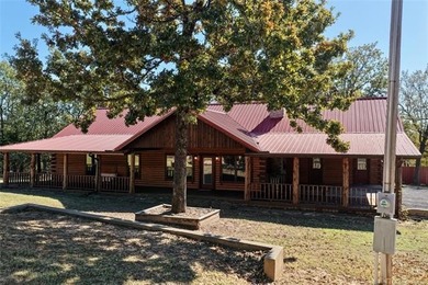 STUNNING LOG CABIN LAKE HOME WITH GUEST HOUSE, SHOP AND BOAT