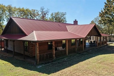 STUNNING LOG CABIN LAKE HOME WITH GUEST HOUSE, SHOP AND BOAT