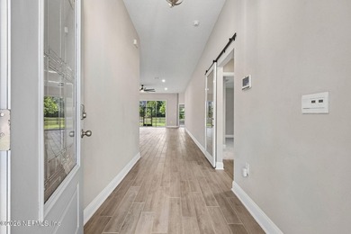 Nestled within the prestigious gated community of Osprey Cove - photo 3