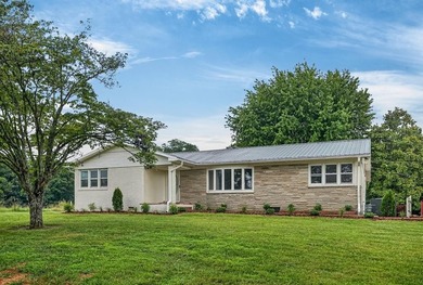 Completely remodeled and move-in ready! This beautiful brick - photo 1
