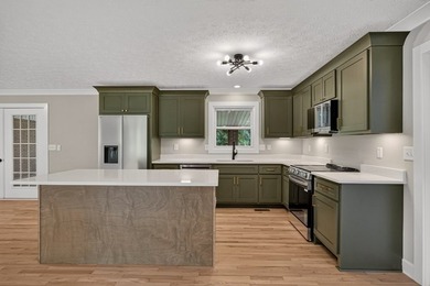 Completely remodeled and move-in ready! This beautiful brick - photo 7