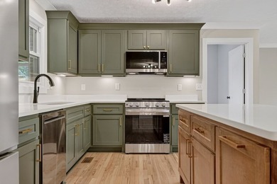 Completely remodeled and move-in ready! This beautiful brick - photo 8