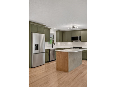 Completely remodeled and move-in ready! This beautiful brick - photo 9