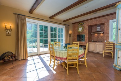 Set on over 5 acres of lushly landscaped grounds, the riverside - photo 13