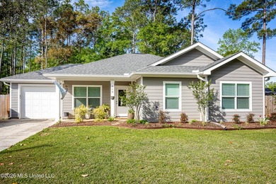 Tucked away in a charming coastal town, this 4-bedroom, 2-bath - photo 1