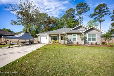 Tucked away in a charming coastal town, this 4-bedroom, 2-bath - photo 2