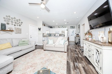Tucked away in a charming coastal town, this 4-bedroom, 2-bath - photo 4