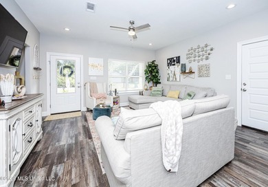 Tucked away in a charming coastal town, this 4-bedroom, 2-bath - photo 5