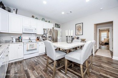 Tucked away in a charming coastal town, this 4-bedroom, 2-bath - photo 8