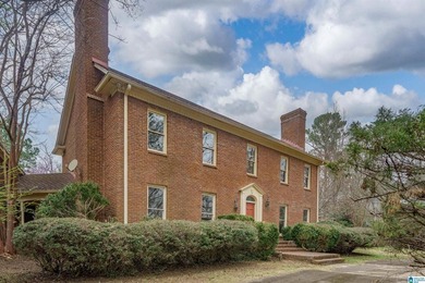This full brick estate in Mountain Brook sitting on 2 acres can