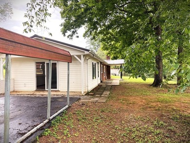 Tucked away on 5 fully fenced acres, this unique 3-bed, 2-bath - photo 4
