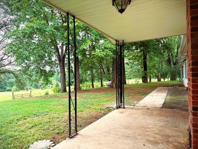 Tucked away on 5 fully fenced acres, this unique 3-bed, 2-bath - photo 7