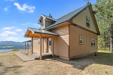 Perched above Lake Roosevelt on 10 private acres, this charming - photo 3