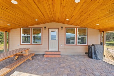 Perched above Lake Roosevelt on 10 private acres, this charming - photo 8