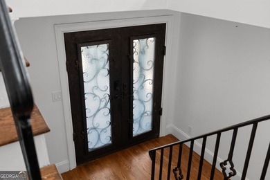 Nestled on a private wooded lot in the highly sought-after - photo 11