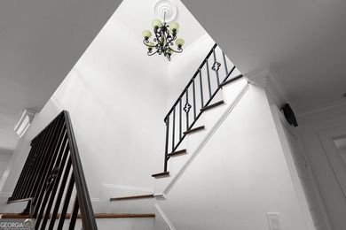 Nestled on a private wooded lot in the highly sought-after - photo 14