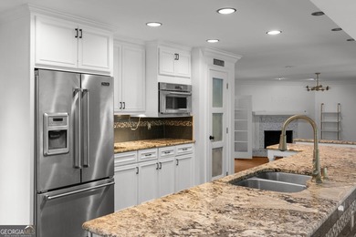 Nestled on a private wooded lot in the highly sought-after - photo 18