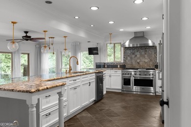 Nestled on a private wooded lot in the highly sought-after - photo 19