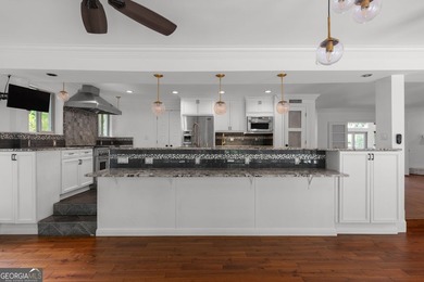 Nestled on a private wooded lot in the highly sought-after - photo 23