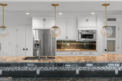 Nestled on a private wooded lot in the highly sought-after - photo 24