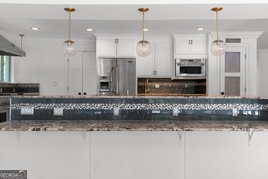 Nestled on a private wooded lot in the highly sought-after - photo 25