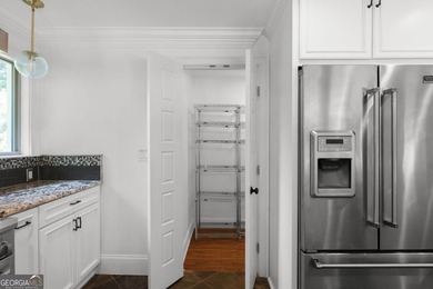 Nestled on a private wooded lot in the highly sought-after - photo 26