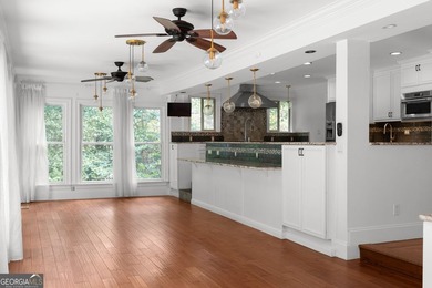 Nestled on a private wooded lot in the highly sought-after - photo 32
