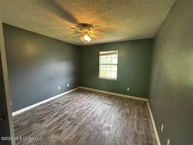This property features 3 bedrooms and 2 bathrooms. Covered back - photo 12