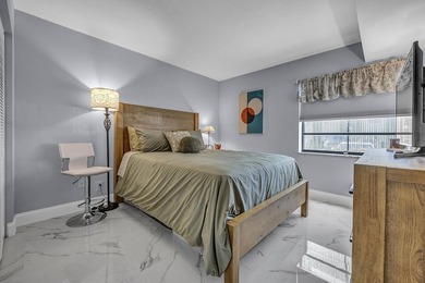 Completely updated first floor 2 bedroom, 2 bath residence in - photo 11