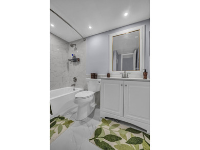 Completely updated first floor 2 bedroom, 2 bath residence in - photo 12