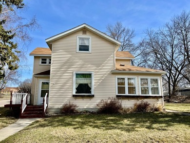 Charming cottage-style home showcasing distinctive woodwork - photo 1