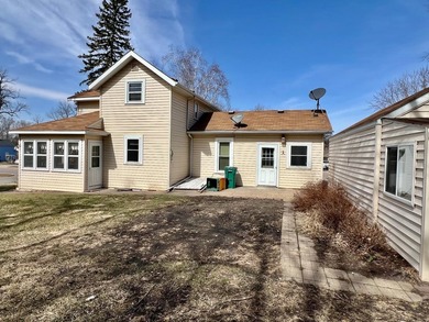 Charming cottage-style home showcasing distinctive woodwork - photo 2