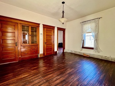 Charming cottage-style home showcasing distinctive woodwork - photo 4