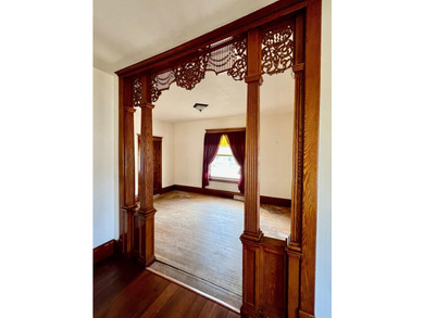 Charming cottage-style home showcasing distinctive woodwork - photo 7