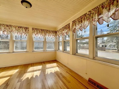 Charming cottage-style home showcasing distinctive woodwork - photo 9