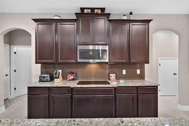 Virtually Staged. Enjoy golf and water views from this - photo 14
