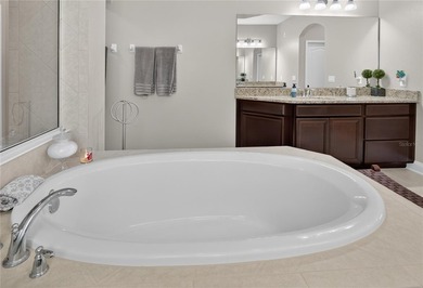 Virtually Staged. Enjoy golf and water views from this - photo 24