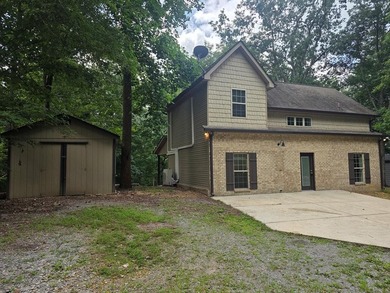 Tucked into a private, wooded setting just minutes from Center - photo 2