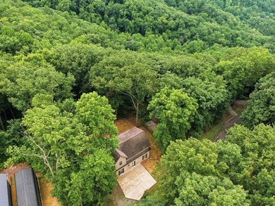 Tucked into a private, wooded setting just minutes from Center - photo 4