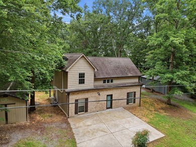 Tucked into a private, wooded setting just minutes from Center - photo 6