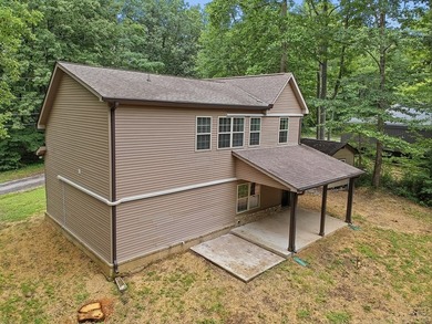 Tucked into a private, wooded setting just minutes from Center - photo 9