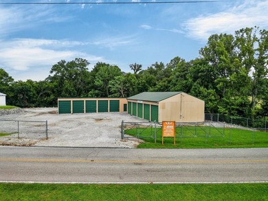 Income-producing storage property featuring 25 units with space - photo 1