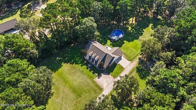 PRICE REDUCED! Situated on 7 acres with a pond and a 30' - photo 9