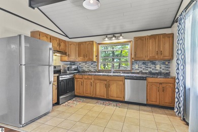 Enjoy beautiful views of Stoneledge Lake from the spacious back - photo 3