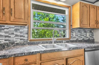 Enjoy beautiful views of Stoneledge Lake from the spacious back - photo 4