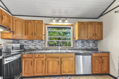 Enjoy beautiful views of Stoneledge Lake from the spacious back - photo 5