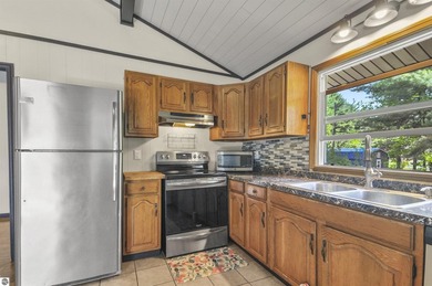 Enjoy beautiful views of Stoneledge Lake from the spacious back - photo 6