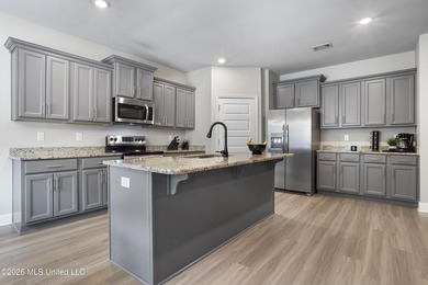 Welcome home to this beautifully maintained 4-bedroom, 3-bath - photo 11
